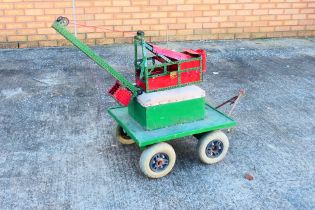 Meccano - A built vintage red and green Meccano crane, sitting on a scratch built wooden trailer.