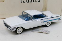 Franklin Mint - Precision Models. A boxed 1960 Chevrolet Impala, appearing in Excellent condition.