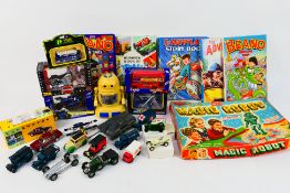 Corgi - Matchbox - Maisto - Merit - A group of cars, annuals and a vintage board game.