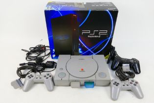 Playstation - Sony. A Sony Playstation 1 in a PS2 box with Three controllers, RF cable, power cable.
