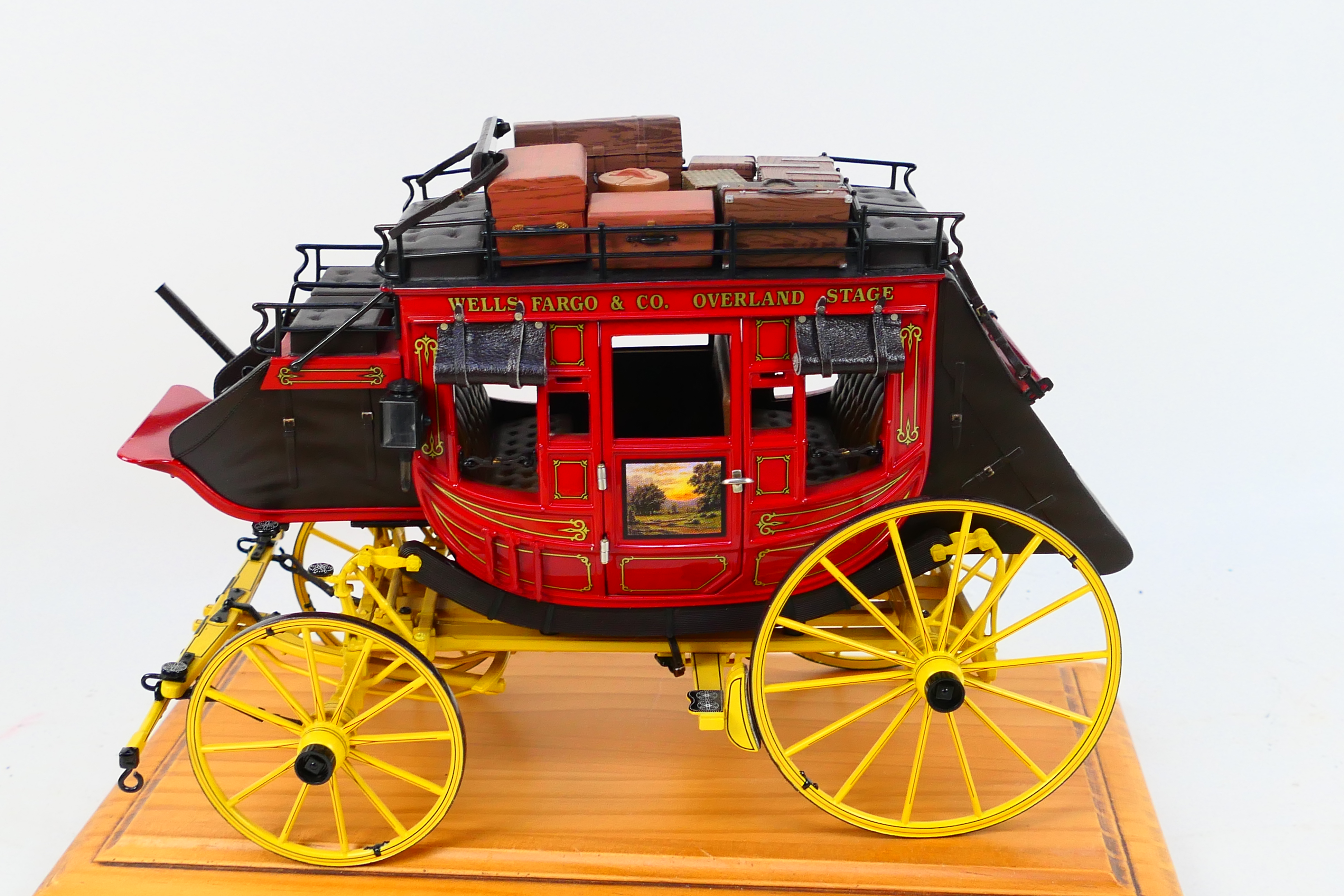 Franklin Mint - A Franklin Mint 1:16 scale Wells Fargo Overland Stagecoach. - Image 5 of 9