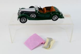 Franklin Mint - Precision Models. A boxed 1938 Alvis 4.3 Litre appearing in Excellent condition.