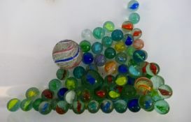 Marbles - A quantity of vintage marbles. All show play wear with conditions generally Fair - Good.