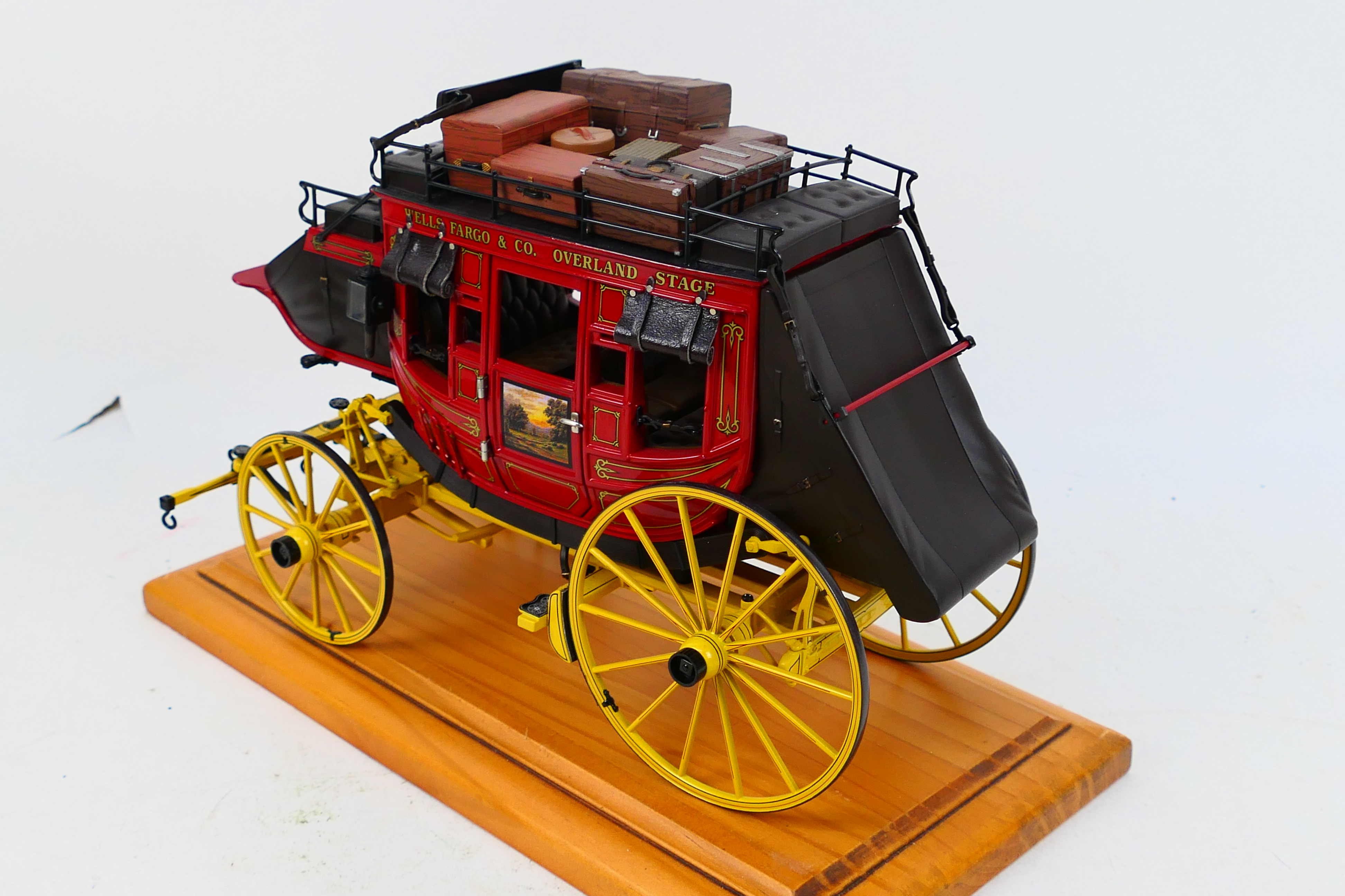 Franklin Mint - A Franklin Mint 1:16 scale Wells Fargo Overland Stagecoach. - Image 7 of 9
