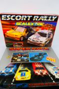 Scalextric - Other - Two slot car racing sets featuring a Scalextric C672 Escort Rally Set,