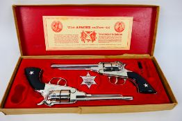 BCM (Derby) - Cap Guns - A vintage boxed 'Outlaw Guns' toy cap gun set by BCM.