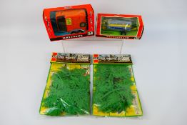 Britains - A collection of boxed Britains farm implements and carded accessories.