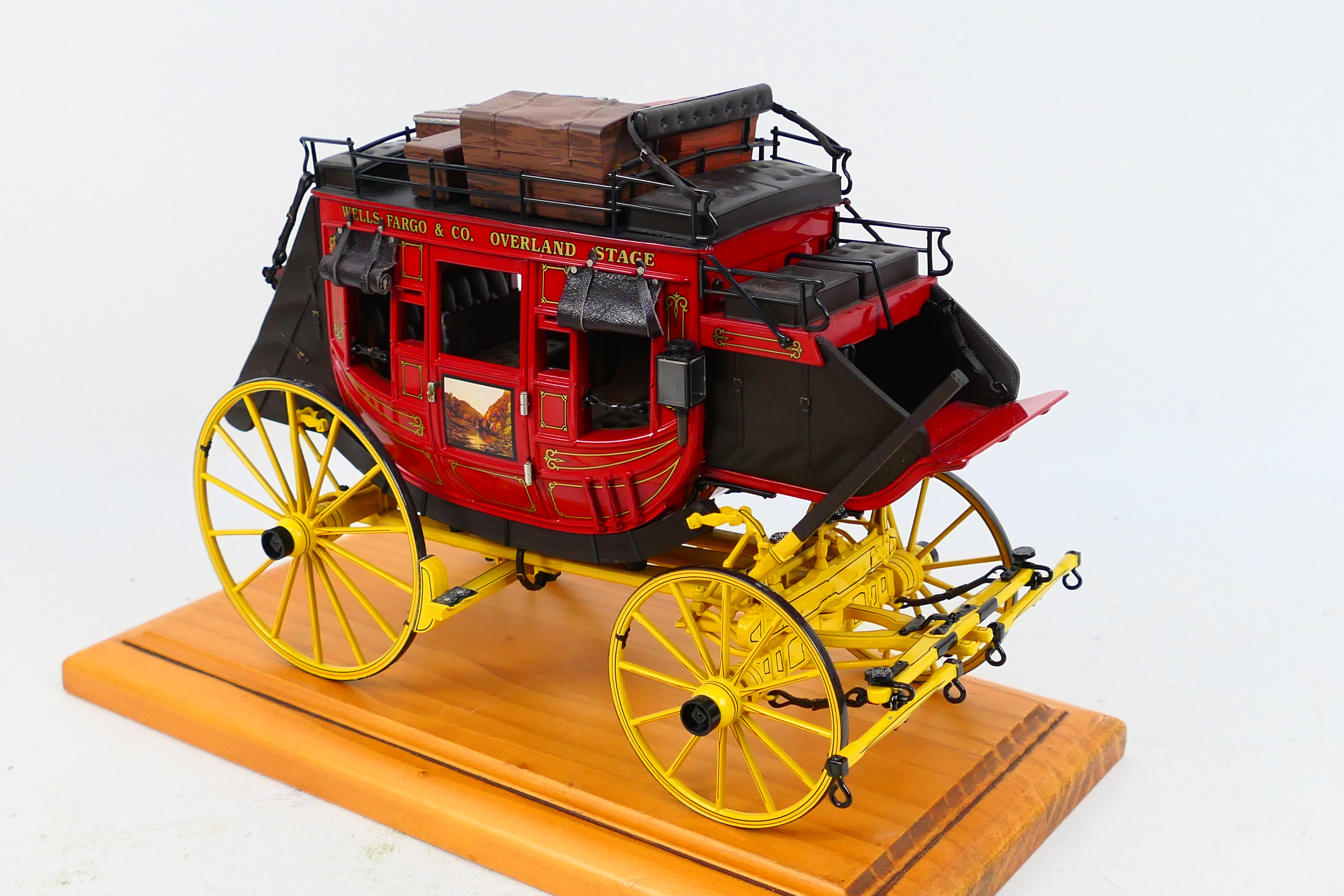 Franklin Mint - A Franklin Mint 1:16 scale Wells Fargo Overland Stagecoach. - Image 3 of 9