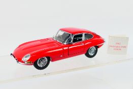 Franklin Mint - Precision Models. A boxed 1961 Jaguar E-Type Coupe appearing in Excellent condition.