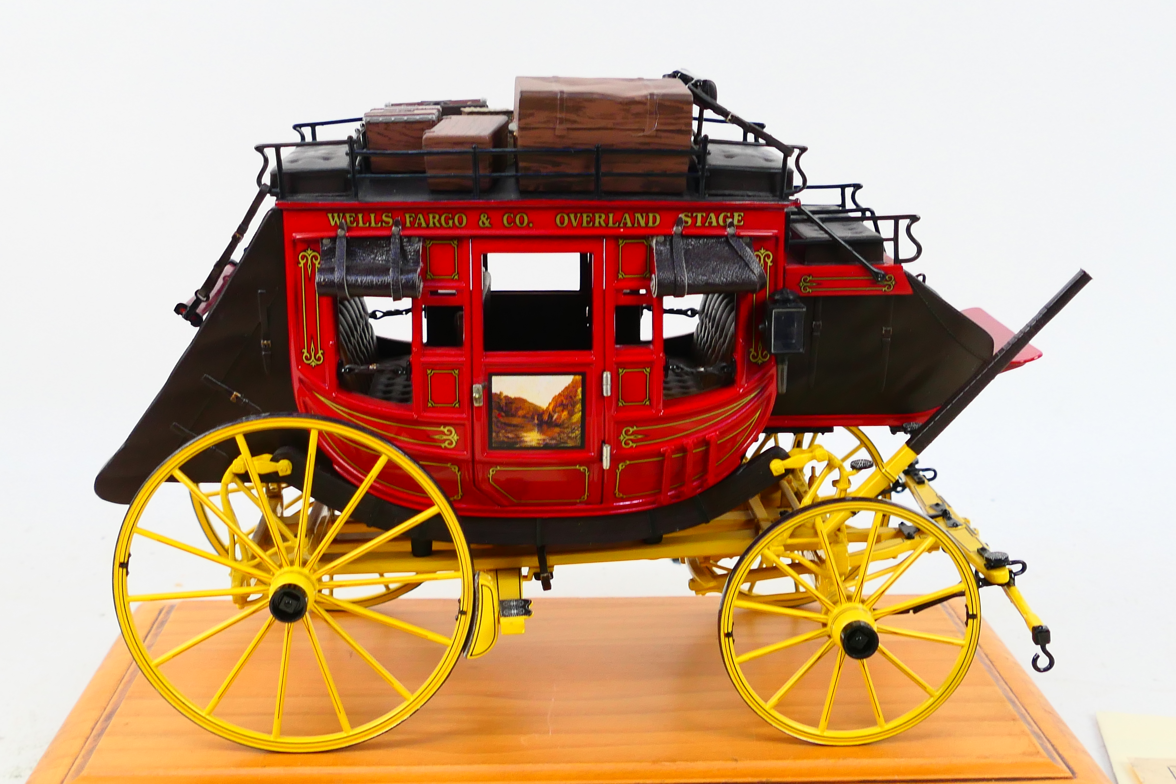 Franklin Mint - A Franklin Mint 1:16 scale Wells Fargo Overland Stagecoach. - Image 2 of 9