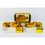 NZG - 3 x boxed Caterpillar construction vehicles, a CAT 621 tractor scraper # 122,