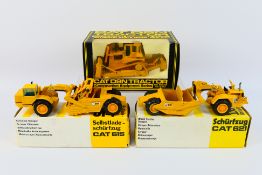 NZG - 3 x boxed Caterpillar construction vehicles, a CAT 621 tractor scraper # 122,