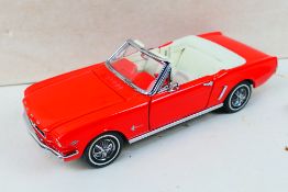 Franklin Mint - Precision Models. A boxed 1964 1/2 Ford Mustang, appearing in Excellent condition.