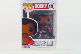 Funko Pop - A boxed Funko Pop 'Rocky' #19 Apollo Creed vinyl figure.