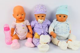 Zapf Creations - Three Zapf Creations Baby Born dolls.
