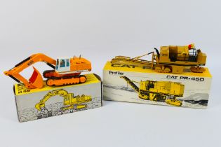 NZG - 2 x boxed construction vehicles in 1:50 scale, a Caterpillar PR-450 Profiler # 299,