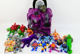 Mattel - He-Man - A collection of He-Man figures with a Snake Mountain play set.