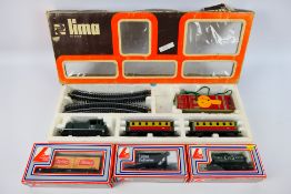 Lima - A boxed Lima HO gauge train set with three boxed items of OO gauge rolling stock Train set