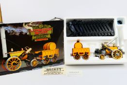 Hornby - A boxed Hornby G100 3 1/2'' gauge Stephensons Rocket Real Steam Train Set,