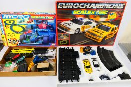 Scalextric - 2 x boxed sets, Eurochampions # C659 and a Micro Scalextric World Championship set.