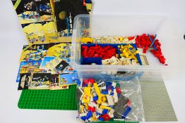 Lego System - A quantity of vintage Lego pieces with a Lego System carry case and 4 x base pieces.
