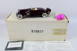 Franklin Mint - A boxed 1:24 scale die-cast 1935 Duesenberg Model J Convertile by Franklin Mint -