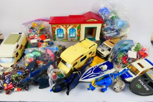 Playmobil - A large quantity of unboxed Playmobil including cars, camper van, a house,