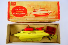 Sutcliffe - A boxed clockwork tinplate Sutcliffe 'Sea Wolf' Atomic Submarine.
