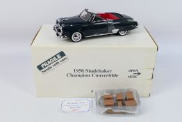 Danbury Mint - A boxed 1:24 scale die-cast 1950 Studebaker Champion Convertible by Danbury Mint -