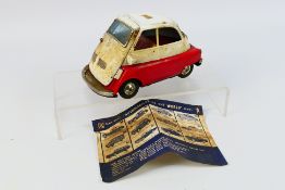 Bandai - A sought after Japanese tin plate Isetta in red and white.