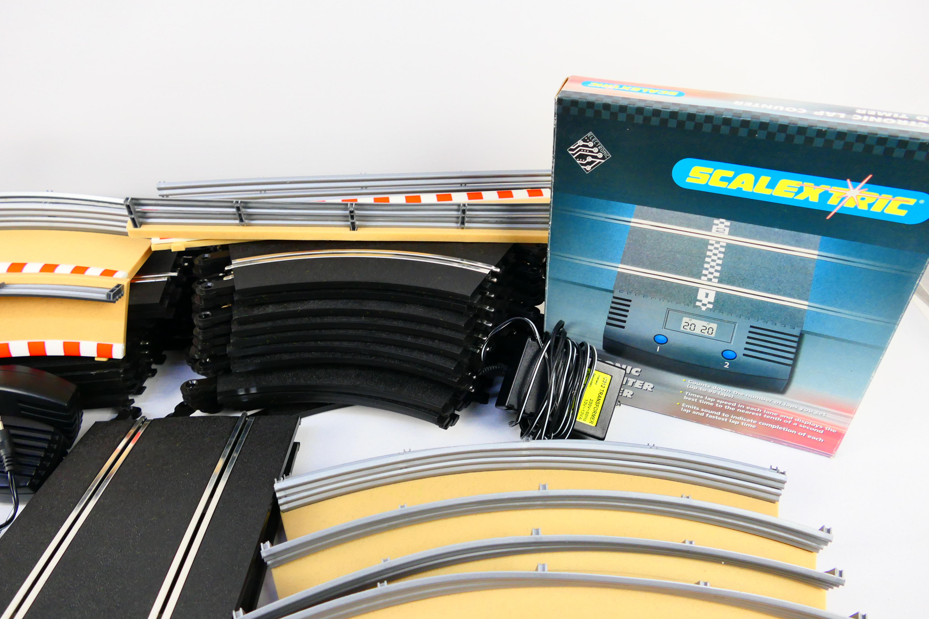 Scalextric - A quantity of slot car track sections, track side barriers, a boxed lap counter timer, - Image 4 of 5
