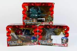 Hasbro - A collection of three Tansformer revenge of the fallen toys from the voyager class.