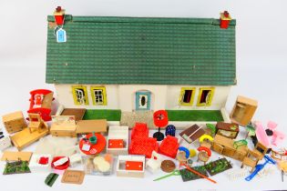 Unmarked Maker - A vintage Dolls 'Bungalow' with a large quantity of doll furniture and accessories.