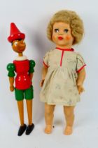Palitoy - A vintage 1950s Palitoy walking doll with sleeping eyes which move side to side when
