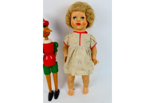 Palitoy - A vintage 1950s Palitoy walking doll with sleeping eyes which move side to side when - Image 2 of 8