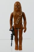 Kenner - Star Wars - A Vintage Star Wars Figure of Chewbacca from 1977 including his weapon