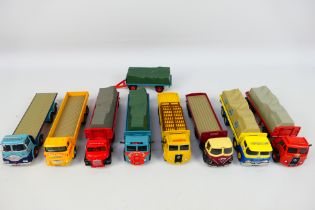 Corgi - An assortment of eight unboxed Diecast Corgi Flatbed wagon and vans comprising of a Blue