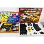 Scalextric - 2 x boxed sets, Eurochampions # C659 and a Micro Scalextric World Championship set.