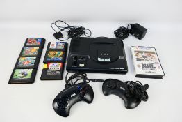 Sega - An unboxed Sega Mega Drive console system (16-BIT) with two controllers and plug.