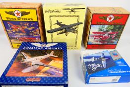 Auto World - Ertl Collectibles - Five boxed diecast model aircraft in various scales.