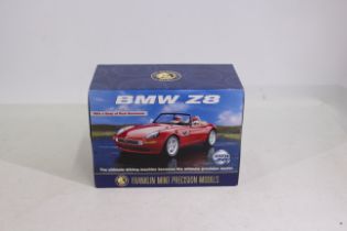 Franklin Mint Models - A Franklin Mint model of a BMW Z8 in red.