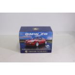 Franklin Mint Models - A Franklin Mint model of a BMW Z8 in red.