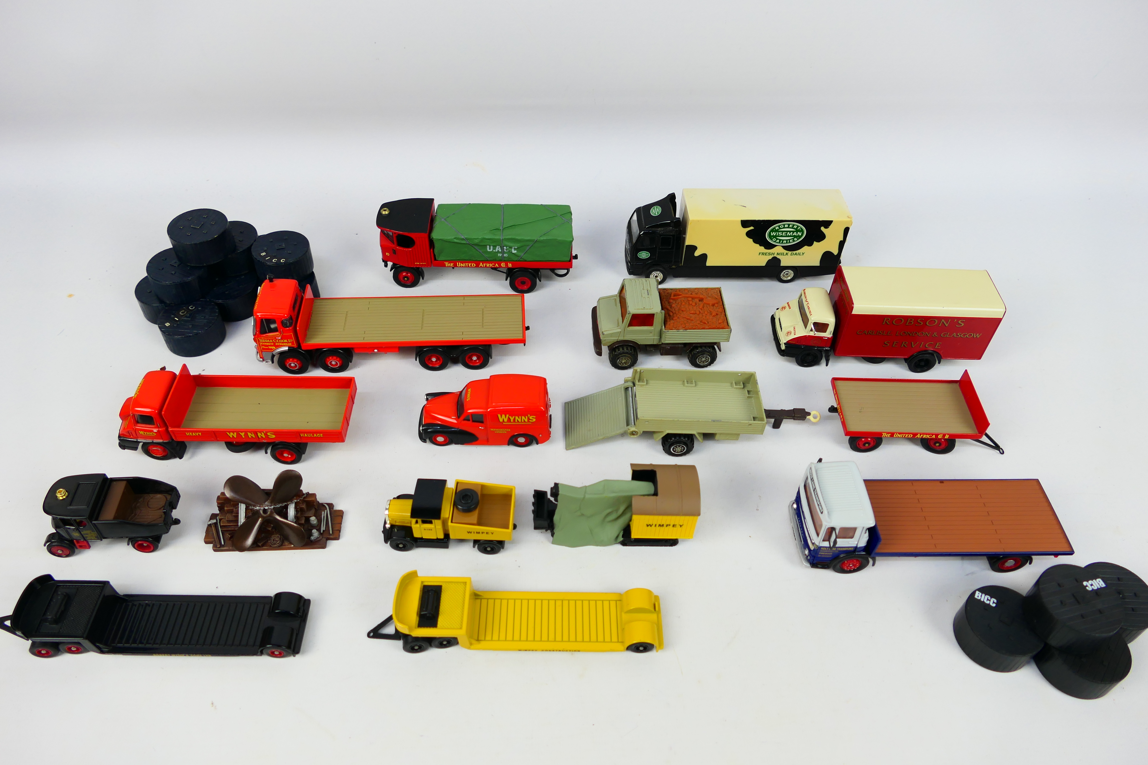 Corgi - An assortment of nine unboxed Diecast Corgi Flatbed wagon and vans comprising of a Wynn's