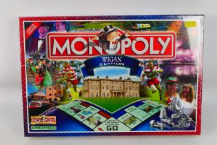 Monopoly - Parker - A boxed, factory sealed 'Wigan Edition' Monopoly board game.