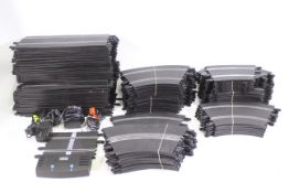 Scalextric - A quantity of Scalextric track sections including straights and curves with a power