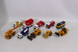 Corgi - A collection of 10 Corgi vehicles including Cement Mixers, Diggers,