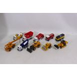 Corgi - A collection of 10 Corgi vehicles including Cement Mixers, Diggers,