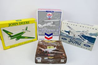 Corgi Aviation Archive - Ertl Collectibles - A boxed diecast model aircraft and three diecast model