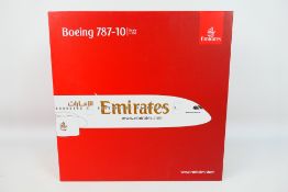 Gemini 200 - Emirates Store - A boxed 1:200 scale Boeing 7487-10 model in Emirates livery #