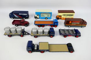 Corgi - An assortment of eight unboxed Diecast Corgi vans and trailers comprising of a Guinness